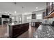Open concept kitchen features a center island that overlooks the adjacent living area at 137 Campaign Dr, Mebane, NC 27302