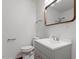 Bathroom with updated vanity, neutral gray, and new mirror at 1512 Bacon St, Durham, NC 27701