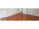 Bedroom with hardwood floors and open doors at 1512 Bacon St, Durham, NC 27701