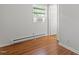 Cozy bedroom with natural light, hard wood floors and neutral paint at 1512 Bacon St, Durham, NC 27701