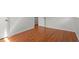 Bedroom with wood floors and an open door at 1512 Bacon St, Durham, NC 27701