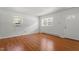 Bright, airy living room with freshly painted walls and pristine hardwood floors at 1512 Bacon St, Durham, NC 27701