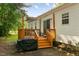 Outdoor shot of the back deck, featuring shade cover and access to the home at 154 Jared Dr, Fuquay Varina, NC 27526
