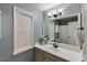 Well-lit bathroom featuring a large mirror, vanity with sink, and a shower-tub combination at 154 Jared Dr, Fuquay Varina, NC 27526