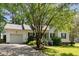 Welcoming single-Gathering home featuring a manicured lawn and an attached garage in a quiet neighborhood at 154 Jared Dr, Fuquay Varina, NC 27526