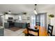 Charming kitchen boasts two-tone cabinets, stainless appliances, and a cozy dining area at 154 Jared Dr, Fuquay Varina, NC 27526