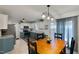 Bright kitchen featuring stainless steel appliances, granite countertops, and an adjacent dining area at 154 Jared Dr, Fuquay Varina, NC 27526