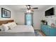 This main bedroom features light gray walls, a ceiling fan, and a tv at 154 Jared Dr, Fuquay Varina, NC 27526