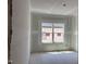 Unfinished bedroom in a new home features a window offering natural light at 1613 Malcus Ct # 68, Fuquay Varina, NC 27526