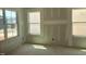 Bright, unfinished bedroom featuring three large windows allowing for ample natural light at 1613 Malcus Ct # 68, Fuquay Varina, NC 27526