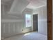 Unfinished bedroom with a window and doorframe visible at 1613 Malcus Ct # 68, Fuquay Varina, NC 27526