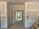 A look down the hallway of an unfinished home at 1613 Malcus Ct # 68, Fuquay Varina, NC 27526