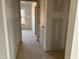 Bright unfinished hallway with neutral walls and doors at 1613 Malcus Ct # 68, Fuquay Varina, NC 27526