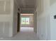 View of the interior of an unfinished home with a view out the window at 1613 Malcus Ct # 68, Fuquay Varina, NC 27526