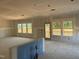 Bright, unfinished living room area featuring several large windows allowing for ample natural light at 1613 Malcus Ct # 68, Fuquay Varina, NC 27526