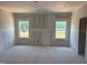 Unfinished Living Room with a double window, newly constructed at 1613 Malcus Ct # 68, Fuquay Varina, NC 27526
