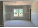 View of the unfinished living room with a large window at 1613 Malcus Ct # 68, Fuquay Varina, NC 27526