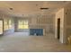 Unfinished living room featuring large windows and a door to the backyard at 1613 Malcus Ct # 68, Fuquay Varina, NC 27526