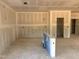 Unfinished living room with drywall and exposed wiring; ready for customization at 1613 Malcus Ct # 68, Fuquay Varina, NC 27526