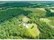 A private residence with fenced pastures, outbuildings and lush green surroundings at 1717 Ormond Rd, Hurdle Mills, NC 27541