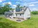 The backyard offers a firepit, a screened porch, and solar panels at 1717 Ormond Rd, Hurdle Mills, NC 27541