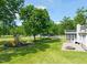 Beautiful backyard featuring a playset, fire pit, and screened-in porch at 1717 Ormond Rd, Hurdle Mills, NC 27541
