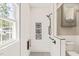 Modern bathroom showcasing a glass shower with a mosaic tile floor and built-in shelving at 1717 Ormond Rd, Hurdle Mills, NC 27541