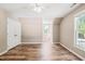Spacious bedroom with hardwood floors, natural light, and closet at 1717 Ormond Rd, Hurdle Mills, NC 27541