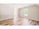 Well-lit bedroom featuring hardwood floors, and ample natural light at 1717 Ormond Rd, Hurdle Mills, NC 27541