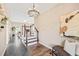 Inviting foyer with decorative lighting, staircase, and stylish accents leading to living spaces at 1717 Ormond Rd, Hurdle Mills, NC 27541