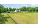Picturesque home set on a large lot with lush greenery and a fenced perimeter at 1717 Ormond Rd, Hurdle Mills, NC 27541