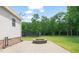 Stone fire pit area in a well-manicured and spacious backyard at 1717 Ormond Rd, Hurdle Mills, NC 27541
