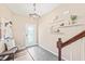 Bright foyer features elegant chandelier, stylish decor, and a welcoming entrance door at 1717 Ormond Rd, Hurdle Mills, NC 27541