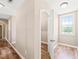 Bright hallway featuring hardwood floors and neutral wall color at 1717 Ormond Rd, Hurdle Mills, NC 27541