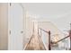 Upstairs hallway featuring hardwood floors, neutral walls, and a staircase at 1717 Ormond Rd, Hurdle Mills, NC 27541