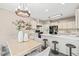 Open-concept kitchen and dining area featuring modern appliances and stylish pendant lighting at 1717 Ormond Rd, Hurdle Mills, NC 27541