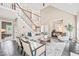 Spacious living area with vaulted ceilings, a staircase, a fireplace, and elegant furnishings creating a relaxing ambiance at 1717 Ormond Rd, Hurdle Mills, NC 27541