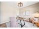 Bright home office featuring a rustic desk, neutral decor, and a cozy seating area at 1717 Ormond Rd, Hurdle Mills, NC 27541