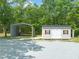 This property includes a well-maintained shed and a car port at 1717 Ormond Rd, Hurdle Mills, NC 27541