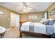 Bedroom featuring tan walls, plush carpeting, and a traditional sleigh bed at 2007 Eastwood Dr, Durham, NC 27703