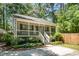 Charming home with a lovely screened front porch and inviting curb appeal at 2007 Eastwood Dr, Durham, NC 27703