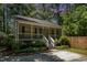 Charming home with a screened-in porch, lush landscaping, and a private driveway at 2007 Eastwood Dr, Durham, NC 27703