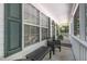 Inviting screened front porch with comfortable seating and charming details at 2007 Eastwood Dr, Durham, NC 27703