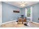 Office space featuring a modern glass desk, stylish seating, and bright natural light at 2007 Eastwood Dr, Durham, NC 27703