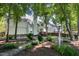 Serene backyard featuring mature trees, a well-maintained lawn, and a glimpse of the home's rear exterior at 203 Halls Mill Dr, Cary, NC 27519