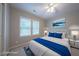Staged bedroom with neutral walls, ceiling fan, and ample natural light at 203 Halls Mill Dr, Cary, NC 27519
