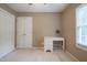 Neutral bedroom with a white desk, a window with blinds, carpet, and a ceiling fan at 203 Halls Mill Dr, Cary, NC 27519