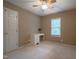 Neutral bedroom featuring a ceiling fan, a window with blinds, and a closet at 203 Halls Mill Dr, Cary, NC 27519