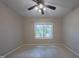 Bedroom featuring a ceiling fan and a window with blinds at 203 Halls Mill Dr, Cary, NC 27519