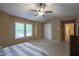 Bedroom with neutral paint, carpet, ceiling fan, and natural light from the window at 203 Halls Mill Dr, Cary, NC 27519